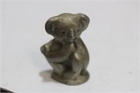 A Miniature Pewter Bear