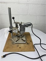 Drill press on wood stand. Works with any drill