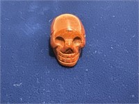 Crystal skull about 1 inch size red