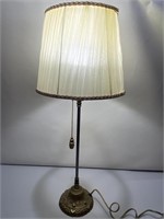 Metal base lamp measures 24 inches tall