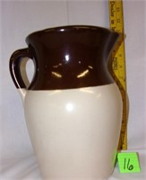 brown/white pottery pitcher w/handle