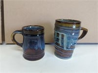Two signed Campbell's pottery mugs