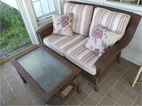 Wicker loveseat and coffee table as is look at