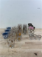 Lot of silver, gold, and blue tumblers/glasses