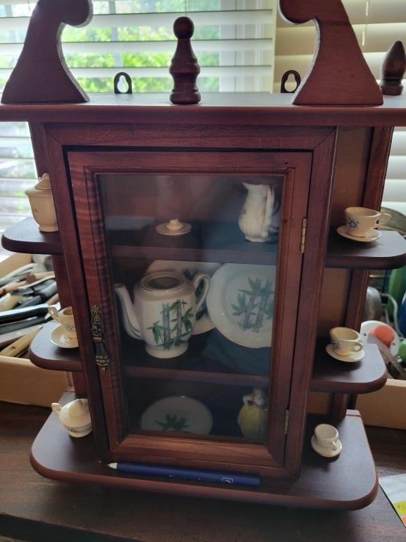 Miniature curio cabinet and contents