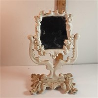 Tiny cast iron mirror