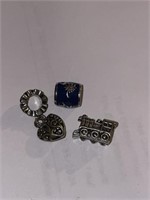 Three charms for Pandora bracelets, one sterling