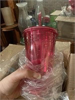 Set of four new plastic tumblers with extra straws