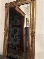 Hanging mirror with gold trim