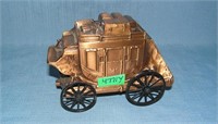 Antique copper toned stage coach coin bank