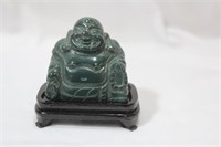 A Nephrite Jade Buddha On Stand