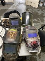 Welding helmets, and a shield