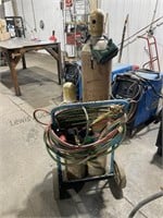 Oxygen and acetylene tanks cart torch goggles and