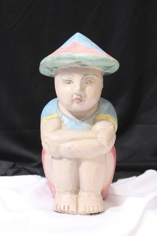 A Polychrome Woodcarving of a Boy