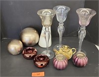 3 wine glasses and candle holders.