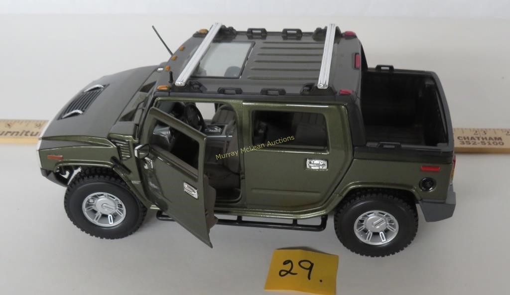 Hummer 1/8 scale Maisto.  NOTE:
