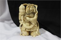 A Carved Bone Oriental Warrior