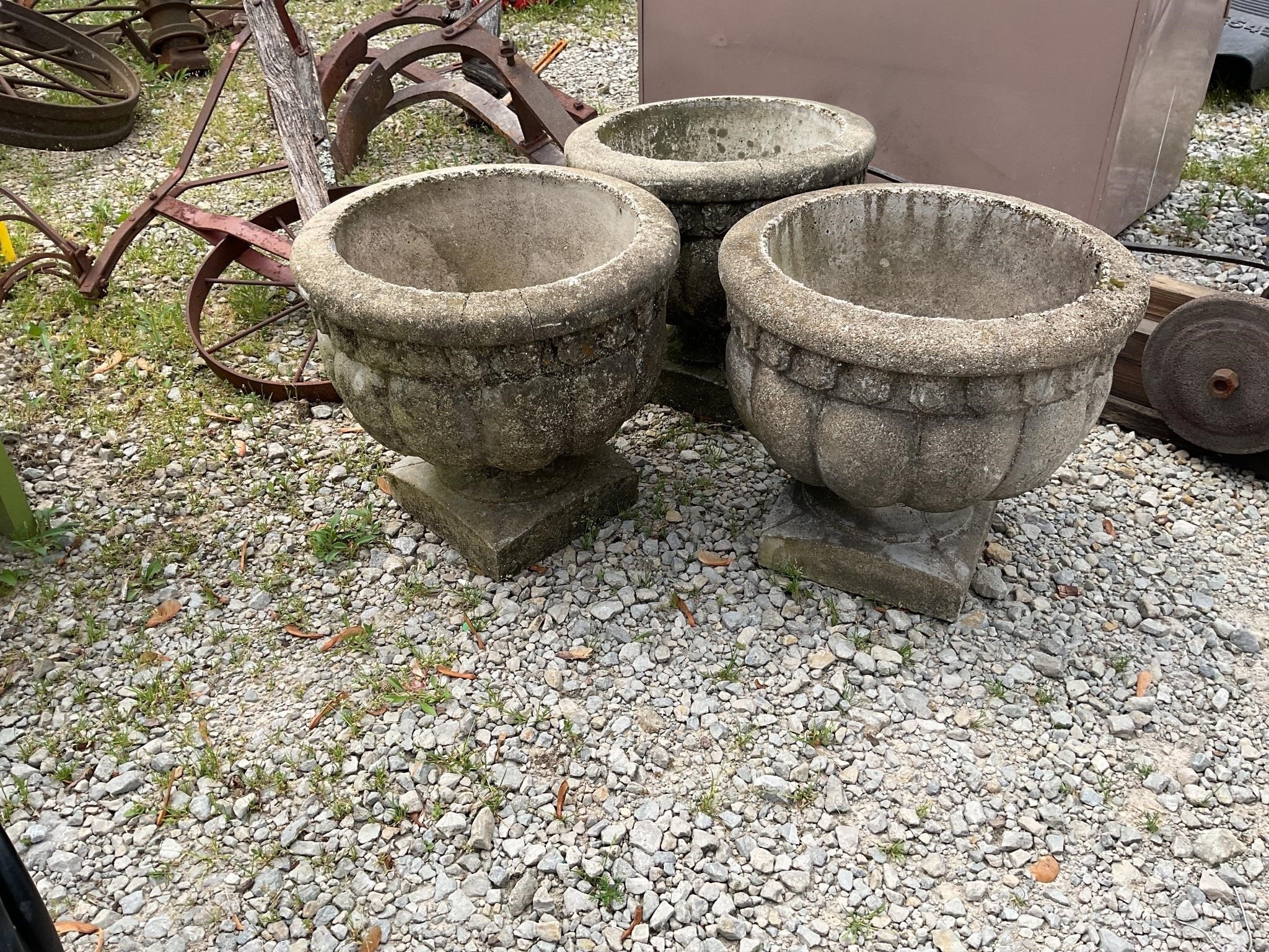 3 small concrete planters