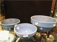 Three blue stoneware mixing bowls, from 6" to 9"