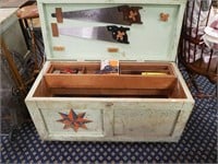 Wooden tool chest containing various tools,