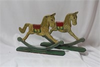 A Pair of Vintage Cast Iron Rocking Horses