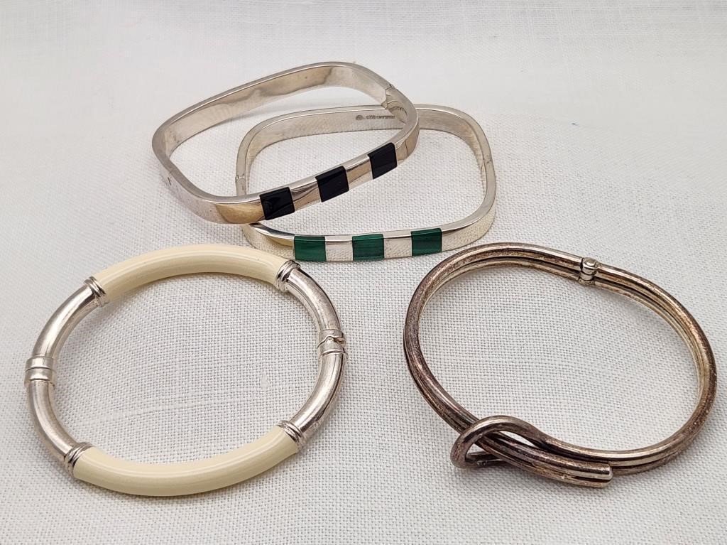 Four Silver Hinged Bracelets