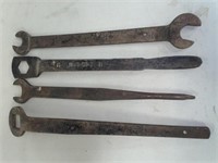 Group of 4 oversized heavy duty wrenches.