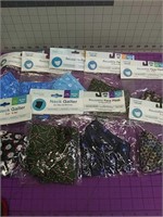 Lot of various reusable mask and neck gaiters.