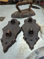cast iron wall hangers and a sad iron