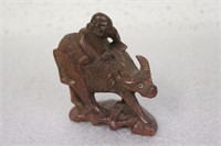 A Vintage Chinese Wooden Cow with Rider