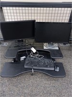 Two Dell computers with keyboard mouse and R