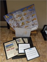 Assortment of picture frames and Aviation posters