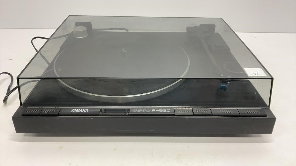 Yamaha turntable, model P-520 with dust cover.