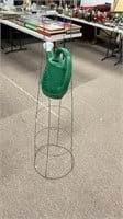 54’’ tomato cage and green watering can