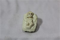 A Miniature Ceramic Nativity Baby
