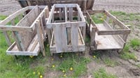 Three small wood feed bunks