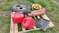 Tire & rim, rim, sewer tile, shovel, gas cans