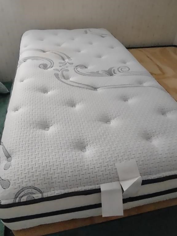 Twin Beauty Rest Mattress with metal frame and