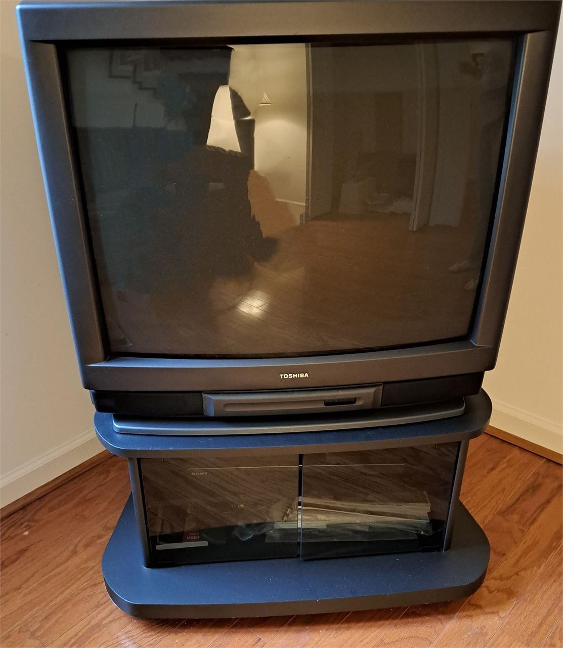 BLACK VINTAGE TV ON TELEVISION STAND 1994