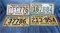 (4) North Dakota License Plates