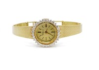 Ladies diamond & 14ct yellow gold watch