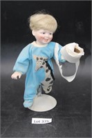 Porcelain Doll & Toilet Paper Roll