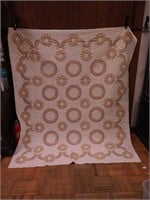 Handstitched quilt with cross stitched design
