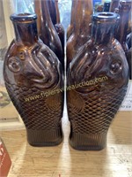 Pair of amber fish bottles