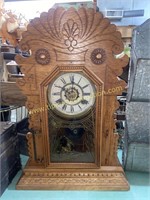 Carved kitchen clock with cranes