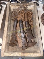 Wrenches and chains in wooden box