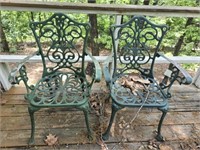 Pair of green metal chairs