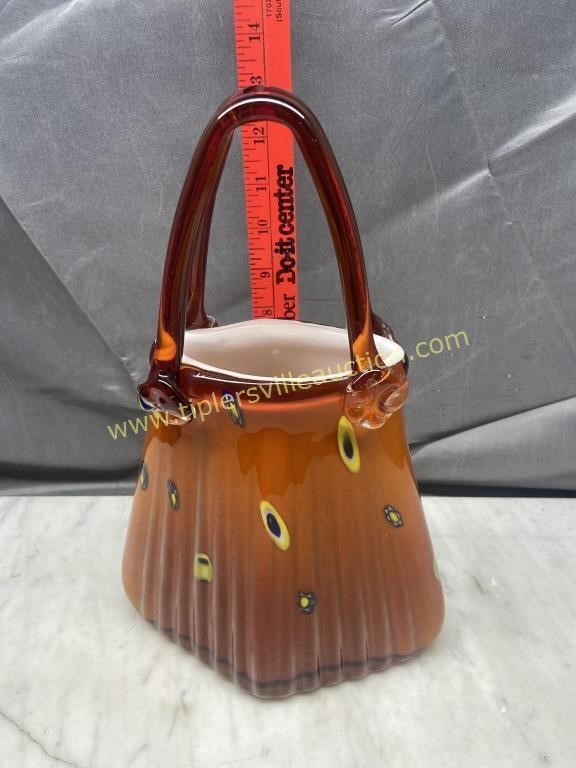 Art glass purse has chip on handle