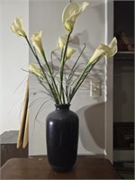 Black ceramic vase with faux flowers
