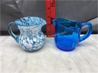 2 blue art glass cream pitchers